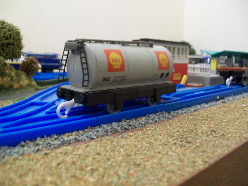 The Hornby tank wagon body is a good match in length and width, for the Plarail chassis, requiring very little work, other than trimming some plastic
